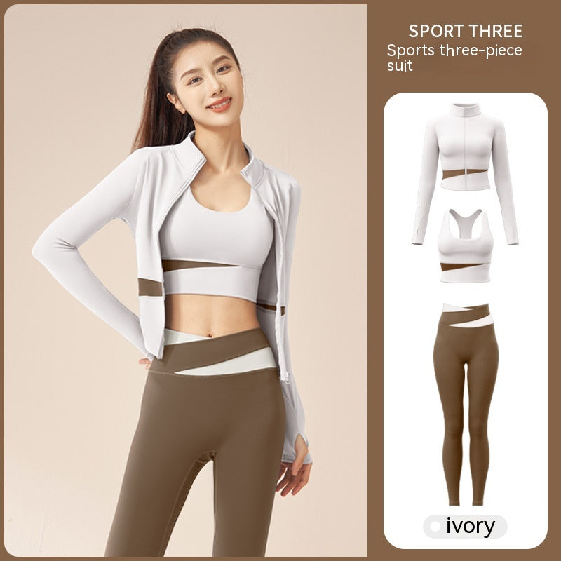 Women's 3-piece workout tracksuit set with zip jacket, sports bra, and yoga trousers