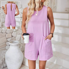Model wearing a casual sleeveless summer shorts jumpsuit with side pockets and a relaxed beach-ready fit