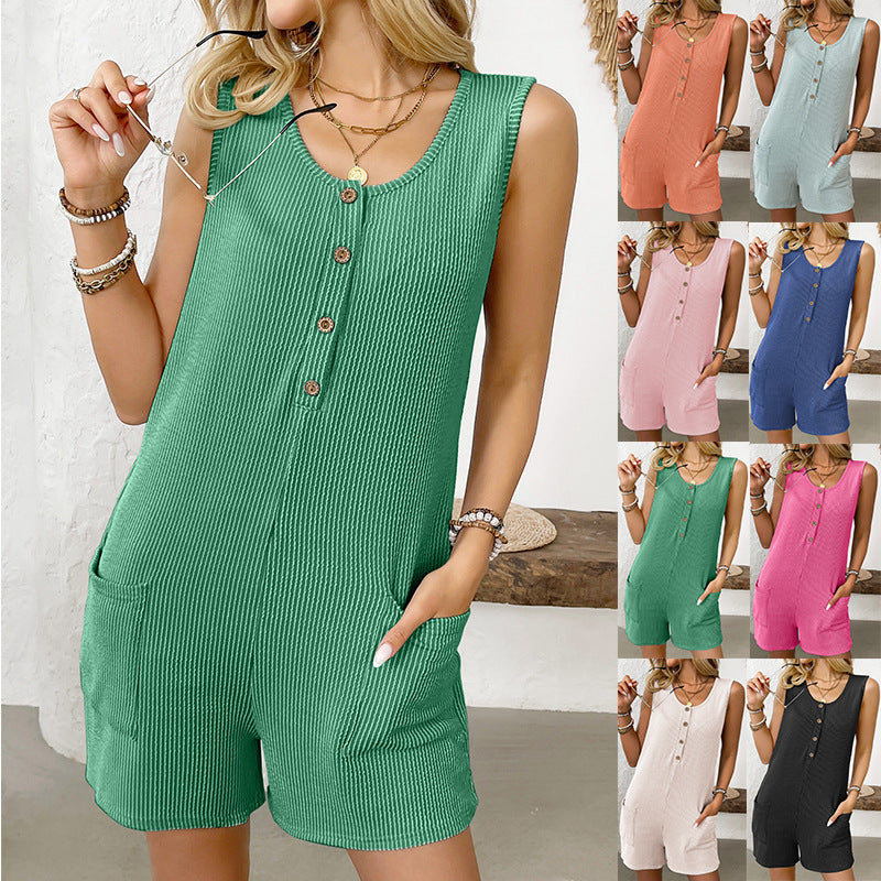 Model wearing a solid color sleeveless summer short jumpsuit romper with side pockets and a casual round neckline