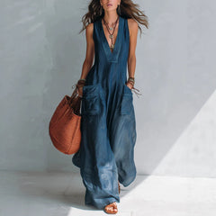 Cozy loose-fit solid color women's harem jumpsuit showing off oversized deep side pockets and a relaxed scoop neckline